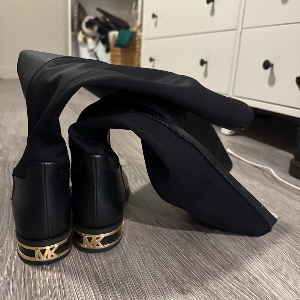 Black Knee-High Boots with Gold Accents